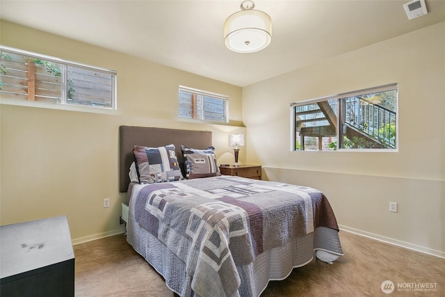 bedroom featuring visible vents and baseboards