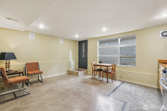 living area featuring recessed lighting, visible vents, baseboards, and finished concrete floors