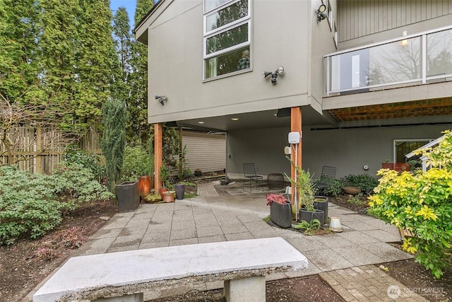 view of patio featuring fence