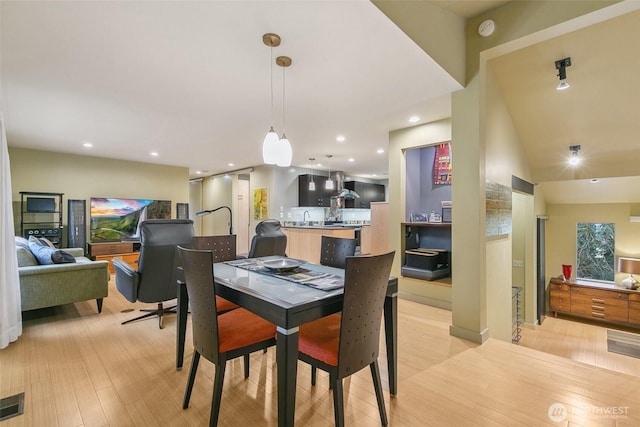 dining space featuring recessed lighting, visible vents, and light wood finished floors