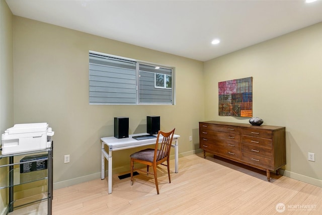 office space with recessed lighting, light wood-style flooring, and baseboards