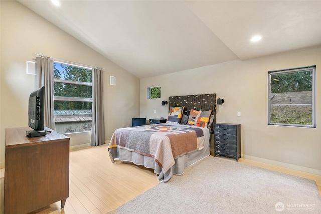 bedroom featuring visible vents, light wood-style flooring, recessed lighting, baseboards, and vaulted ceiling