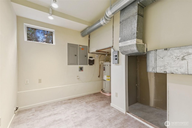 finished basement with electric panel, baseboards, and water heater