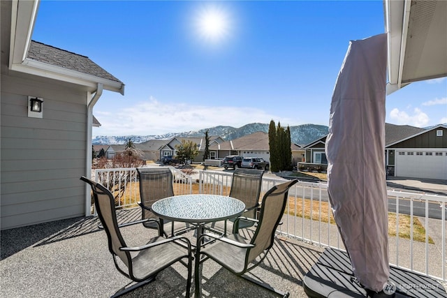 balcony with a residential view and a mountain view