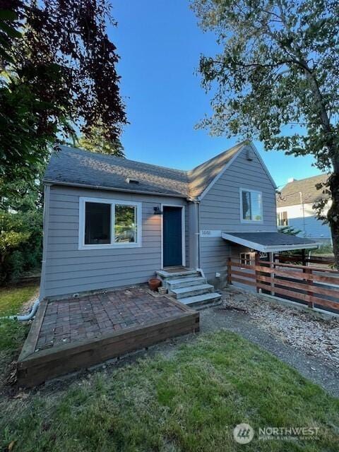 back of house featuring entry steps and a patio