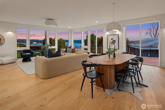 dining area featuring light wood-type flooring and recessed lighting