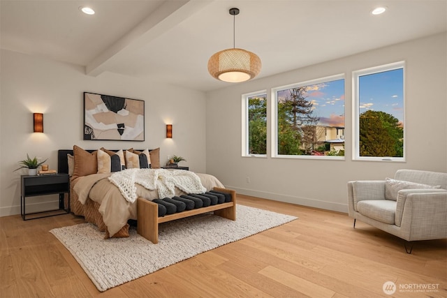 bedroom featuring light wood-style floors, baseboards, beamed ceiling, and recessed lighting