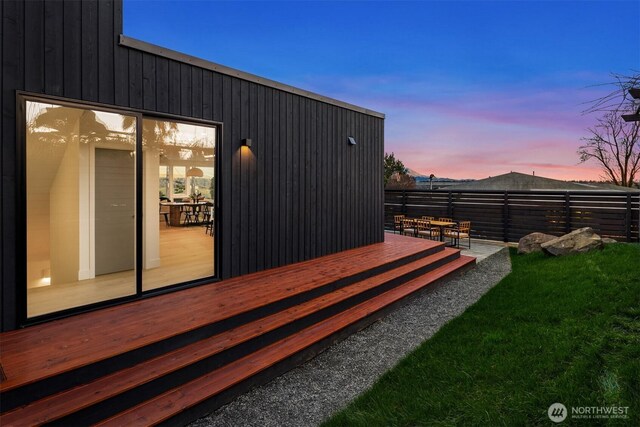 exterior space with fence and a wooden deck