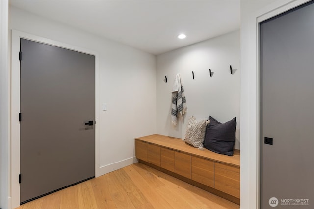 mudroom with light wood finished floors, baseboards, and recessed lighting