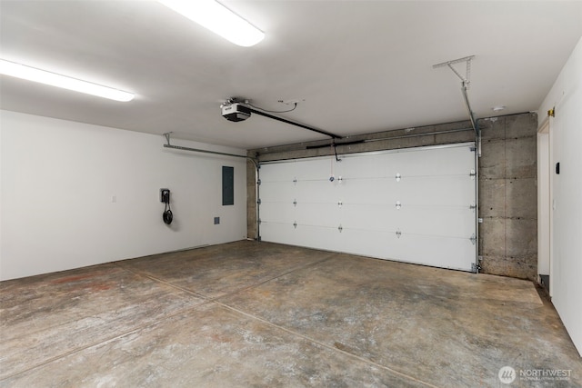 garage with electric panel and a garage door opener