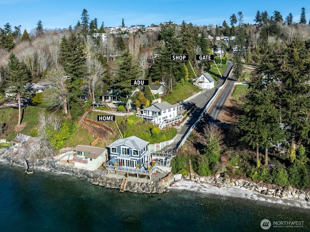 birds eye view of property with a water view