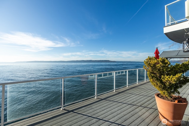 wooden terrace with a water view