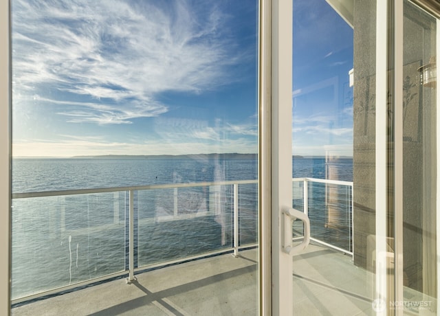 balcony featuring a water view