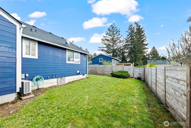 view of yard featuring a fenced backyard and ac unit
