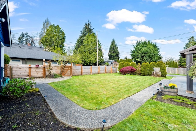 view of yard with a fenced backyard
