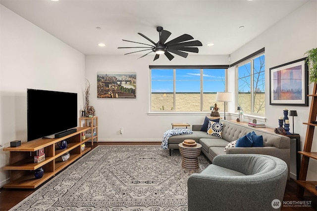 living room featuring recessed lighting, ceiling fan, baseboards, and wood finished floors