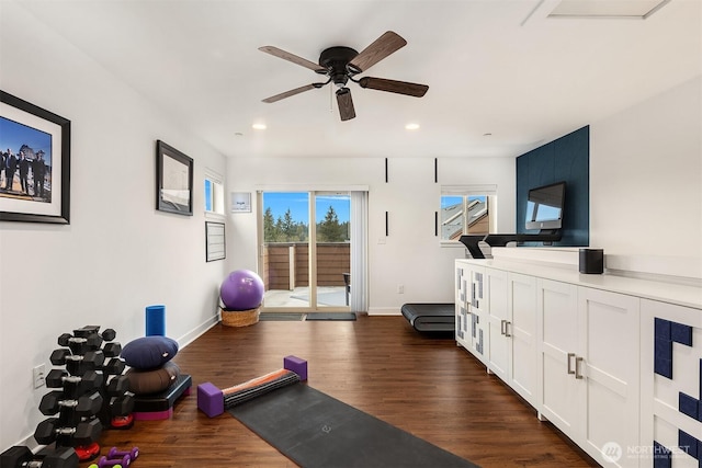 workout room featuring ceiling fan, baseboards, dark wood finished floors, and recessed lighting