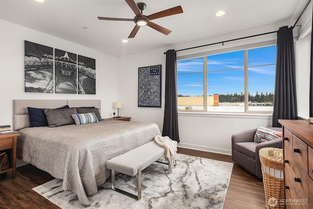 bedroom featuring baseboards, wood finished floors, a ceiling fan, and recessed lighting