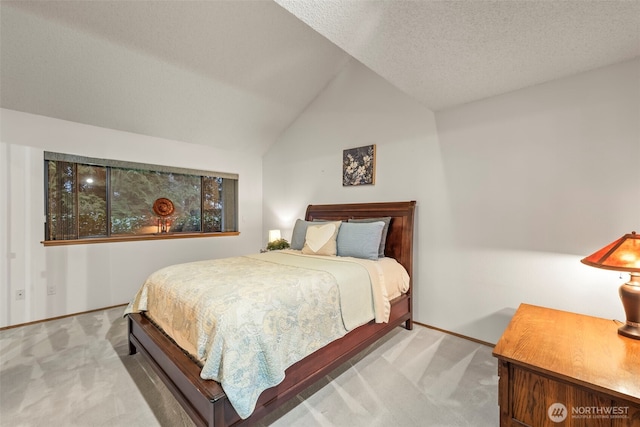 carpeted bedroom with lofted ceiling, baseboards, and a textured ceiling