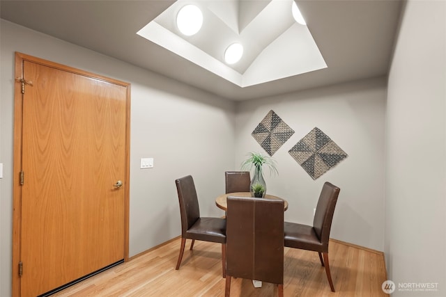 dining area with light wood-style flooring