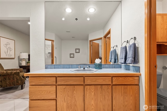 bathroom featuring toilet, recessed lighting, visible vents, and vanity