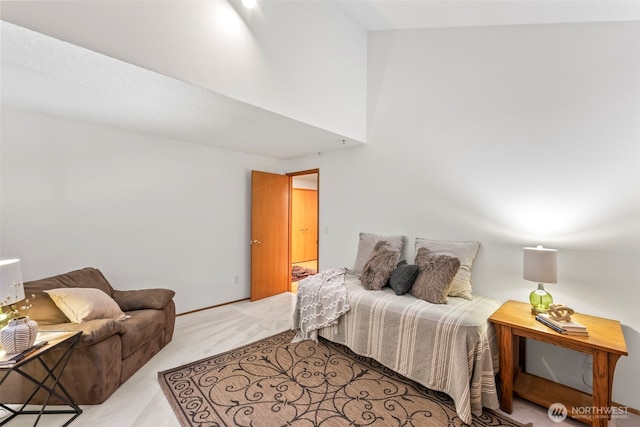 bedroom featuring carpet floors and a towering ceiling