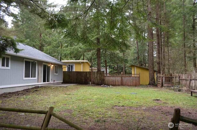 view of yard featuring a patio area and fence