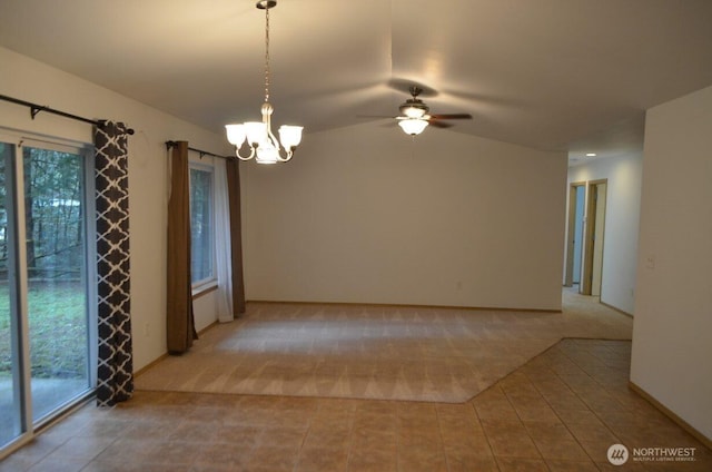 unfurnished room featuring light carpet, vaulted ceiling, and ceiling fan with notable chandelier