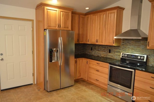 kitchen with tasteful backsplash, dark countertops, wall chimney exhaust hood, stainless steel appliances, and recessed lighting