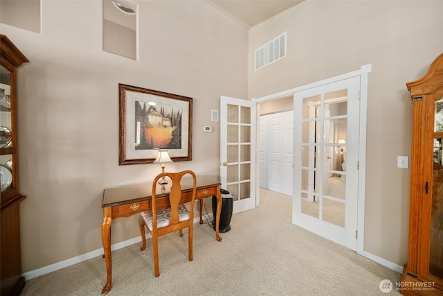 office featuring carpet flooring, french doors, visible vents, and baseboards