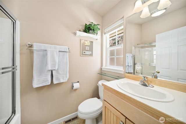 full bathroom featuring toilet, vanity, visible vents, baseboards, and a shower with door