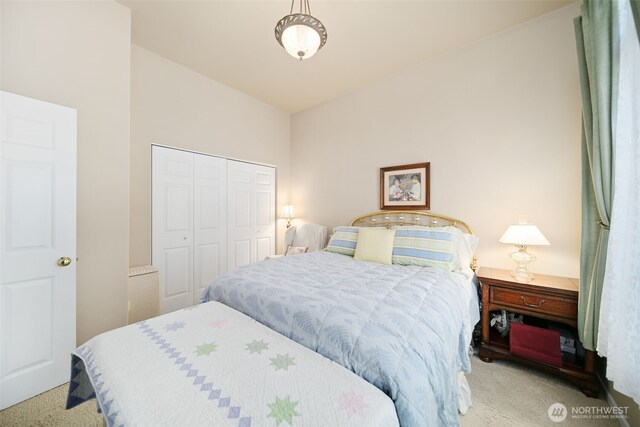 bedroom featuring a closet and carpet flooring