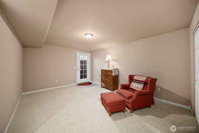 living area with carpet flooring and baseboards