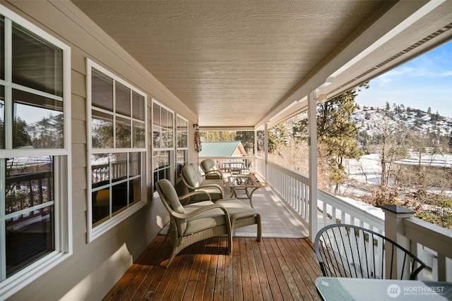 view of snow covered deck