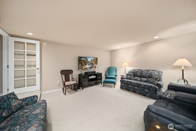 carpeted living room with recessed lighting and baseboards