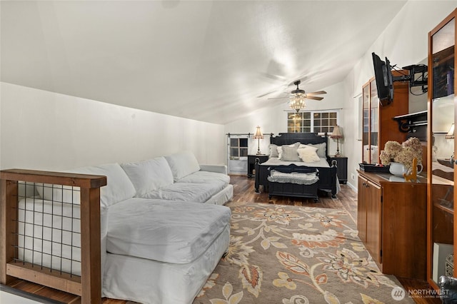 living area featuring a ceiling fan, lofted ceiling, and wood finished floors