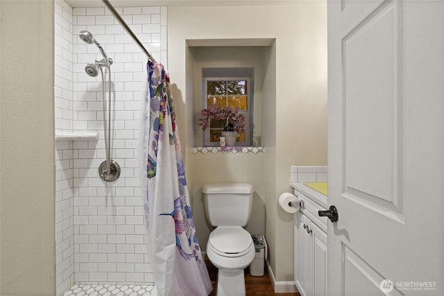 full bath with a shower stall, toilet, and vanity