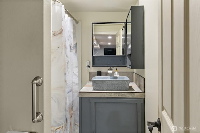 full bath with vanity and a shower with curtain