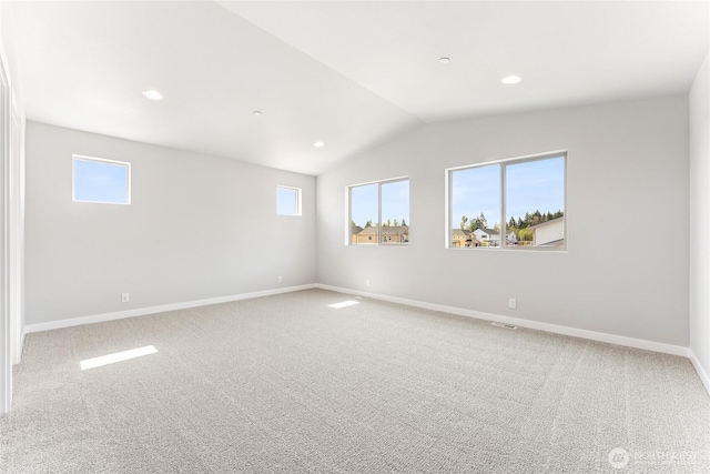 13915 179th St E Unit 58, Puyallup, WA 98374 - spare room featuring lofted ceiling, carpet, baseboards, and recessed lighting