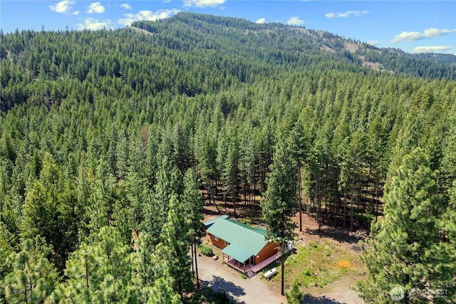 bird's eye view featuring a forest view