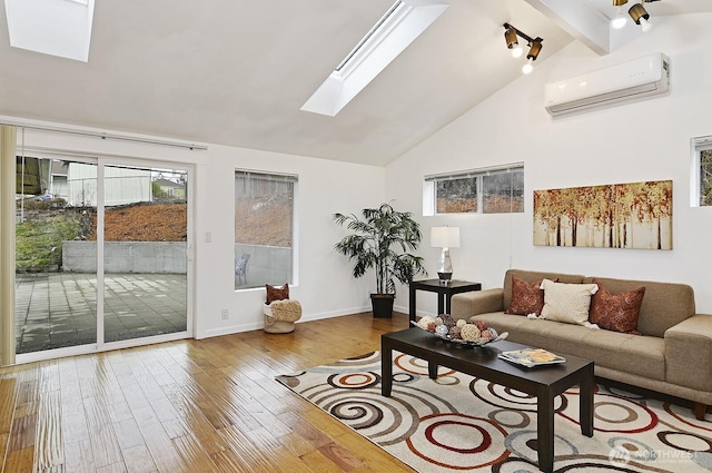 living room featuring high vaulted ceiling, a skylight, wood finished floors, a wall mounted AC, and beam ceiling