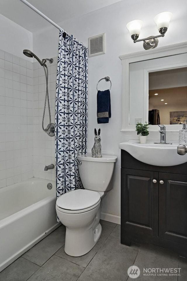 bathroom featuring visible vents, toilet, tile patterned floors, shower / bath combination with curtain, and vanity