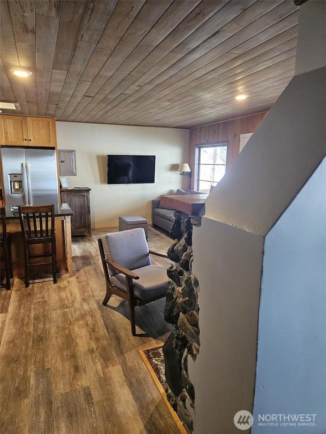 living room featuring wooden ceiling and wood finished floors