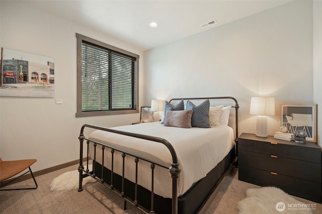 carpeted bedroom with recessed lighting, visible vents, and baseboards