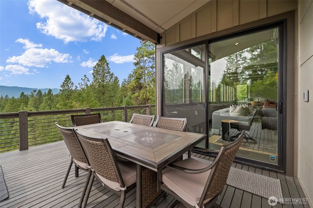 deck featuring outdoor dining area