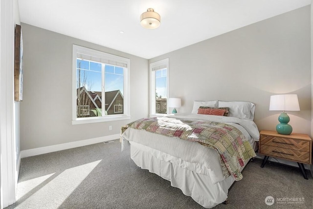 bedroom featuring carpet, visible vents, and baseboards