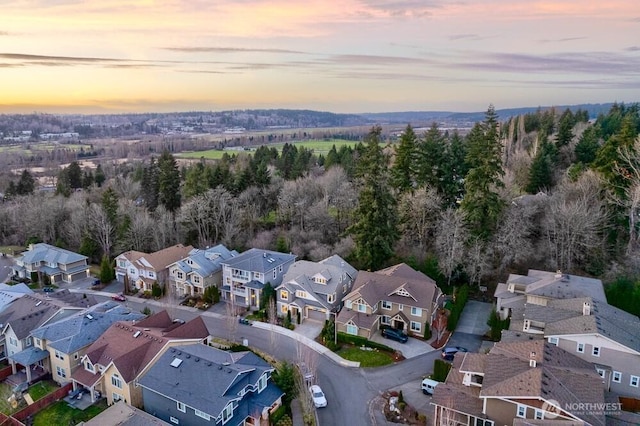 aerial view at dusk with a residential view