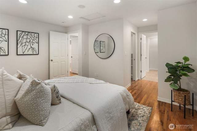 bedroom featuring attic access, recessed lighting, wood finished floors, and baseboards