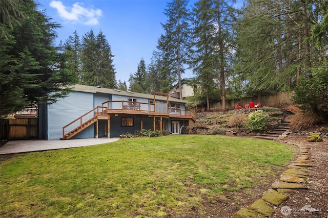 back of property with a patio, fence, stairway, a yard, and a wooden deck