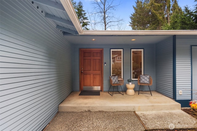 entrance to property featuring a porch